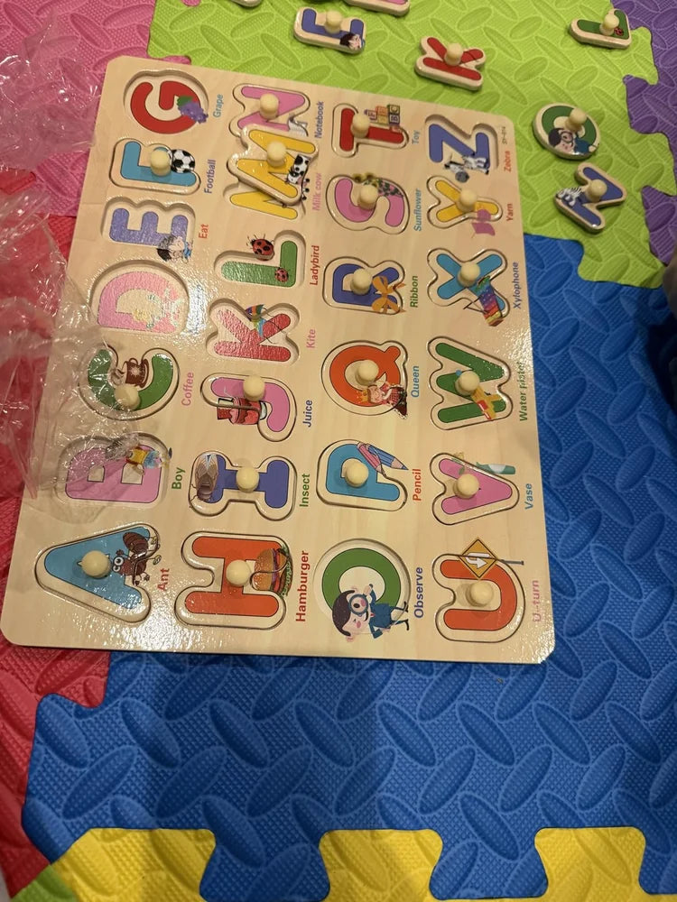 Buyer photograph of the wooden alphabet peg puzzle board