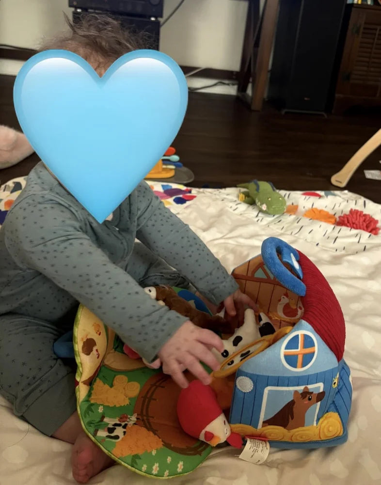 Buyer photo showing the same Farm barn open with plush animals