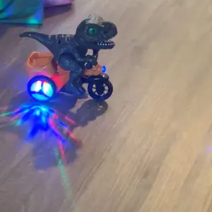 Customer photo of the tricycle projecting colorful lights onto a wood floor